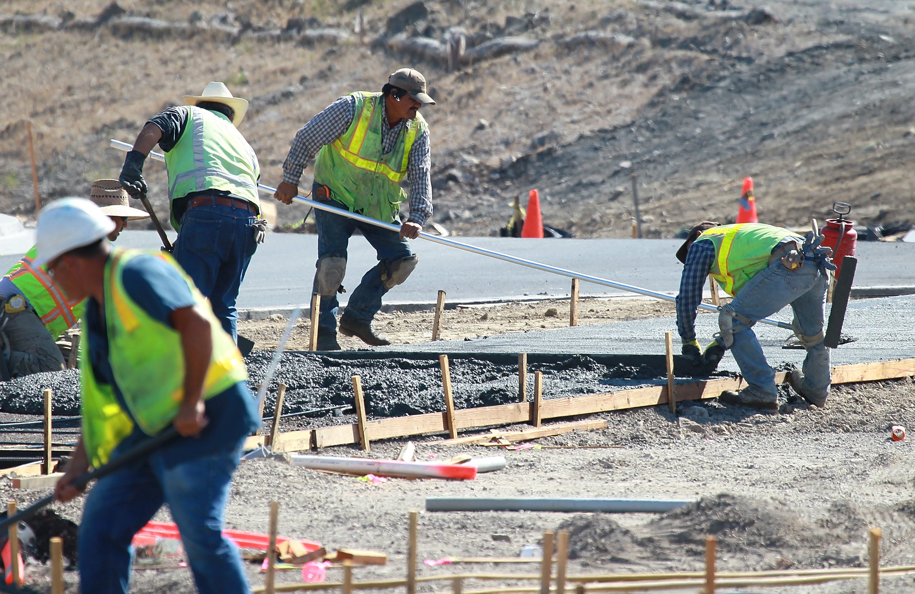 Four construction workers at a job site