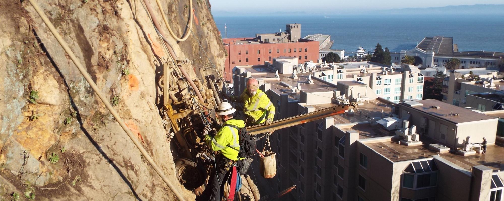 Workers suspended from the cliff of Telegraph Hill