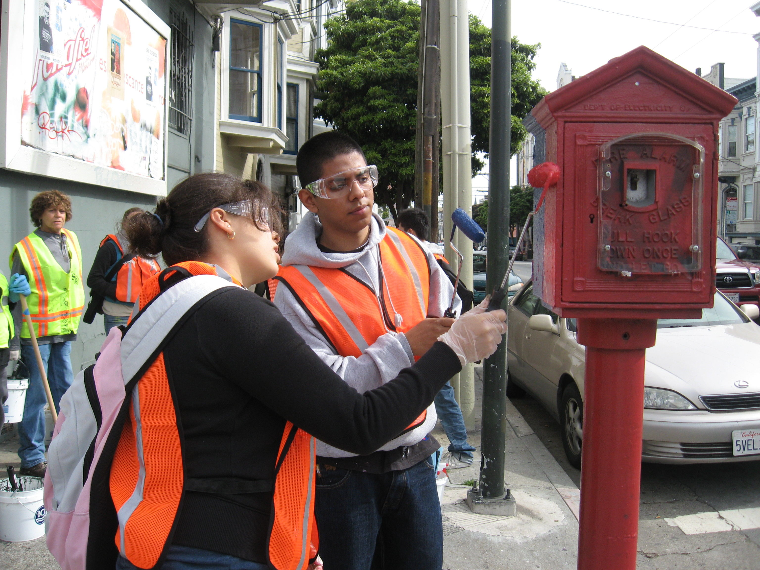 Some volunteers painting graffitti