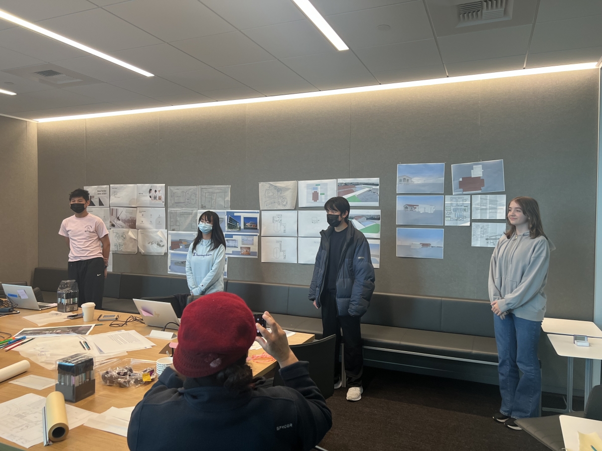 Student interns pinned up drawings and presented their designs and ideas.