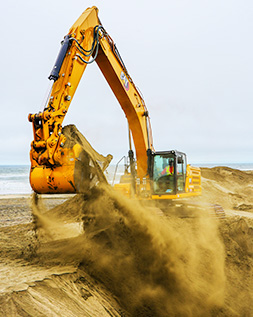 A tractor moving soil