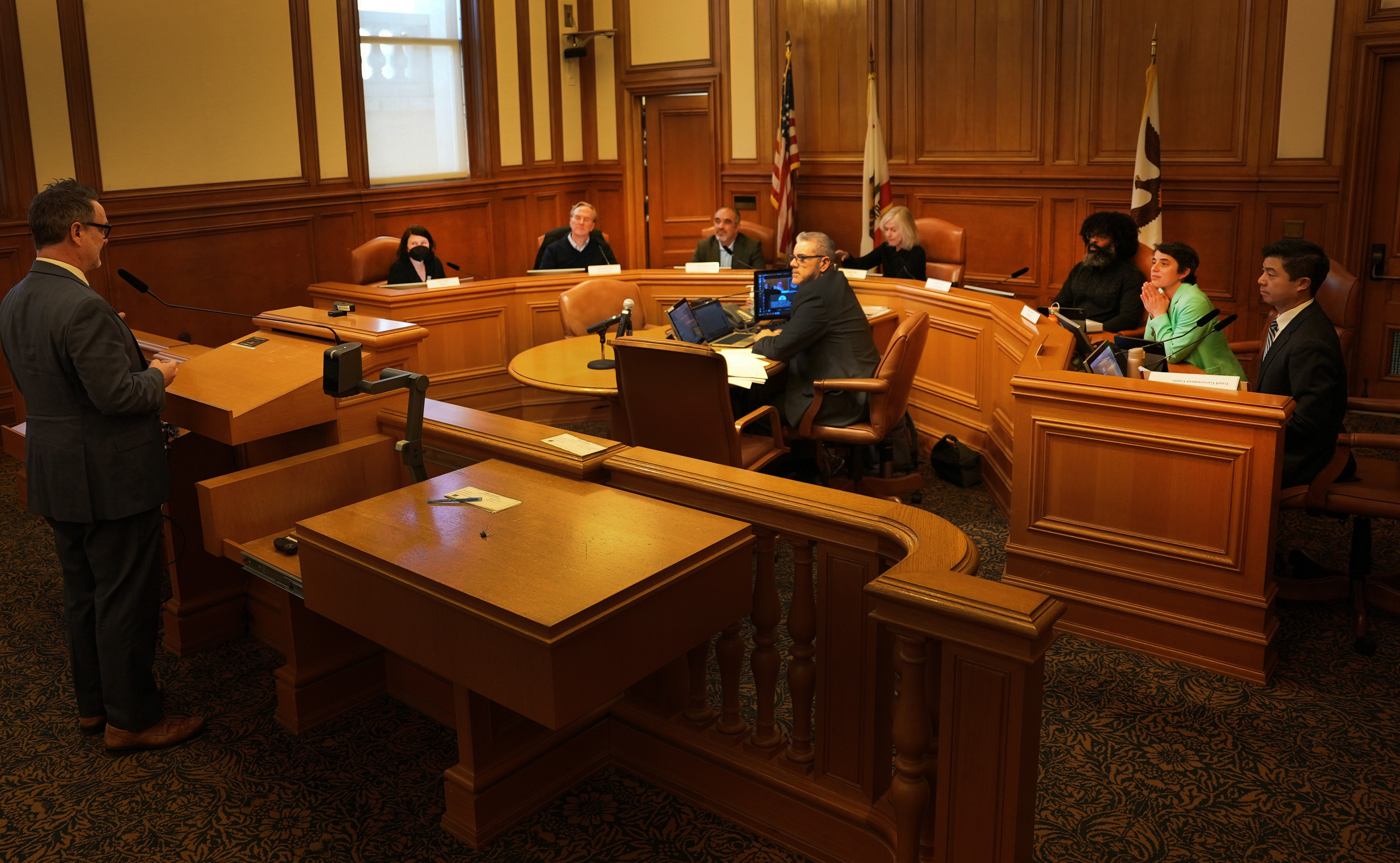 A photo of the Public Works Commission in session.