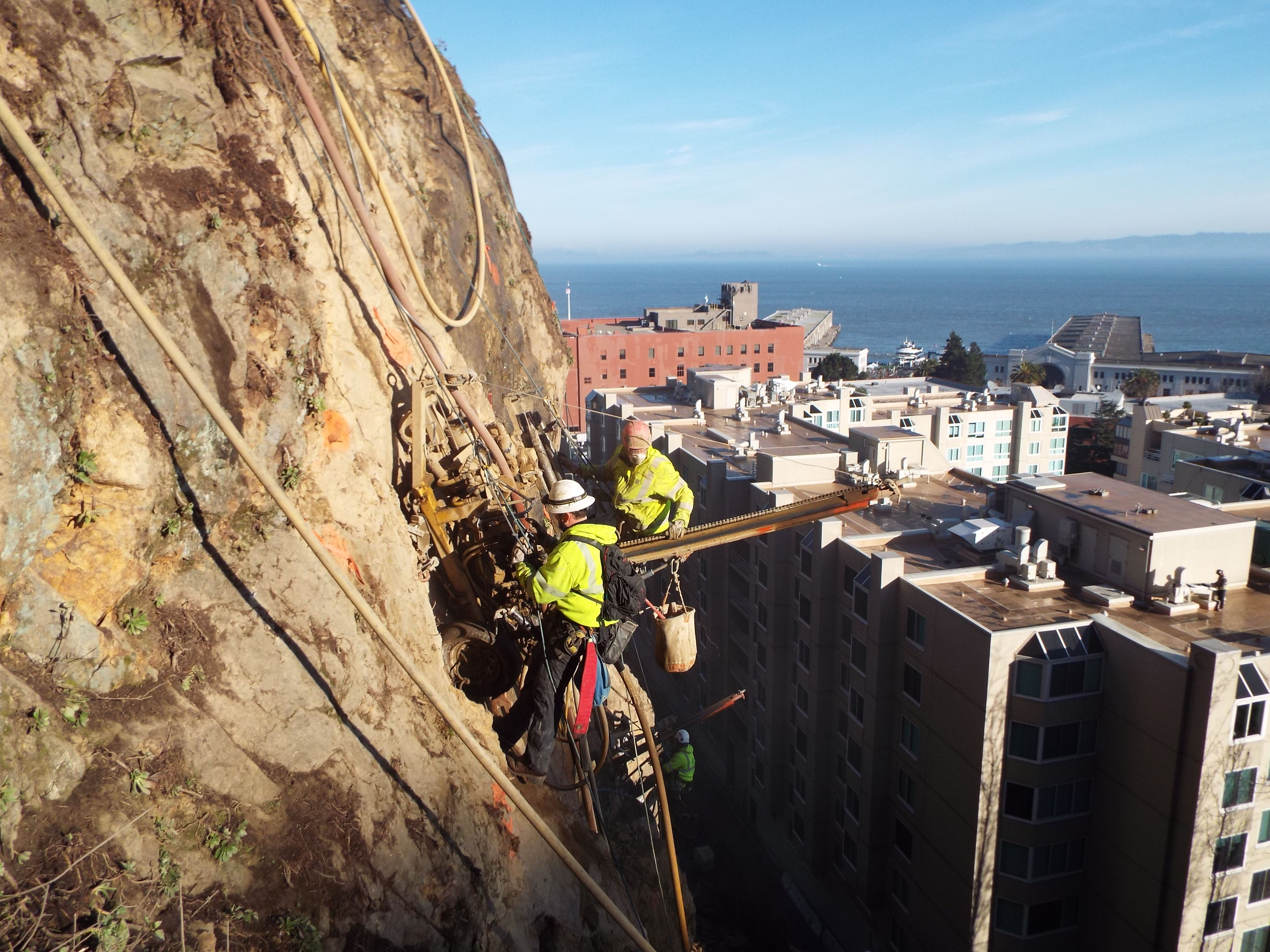 Workers suspended from the cliff of Telegraph Hill