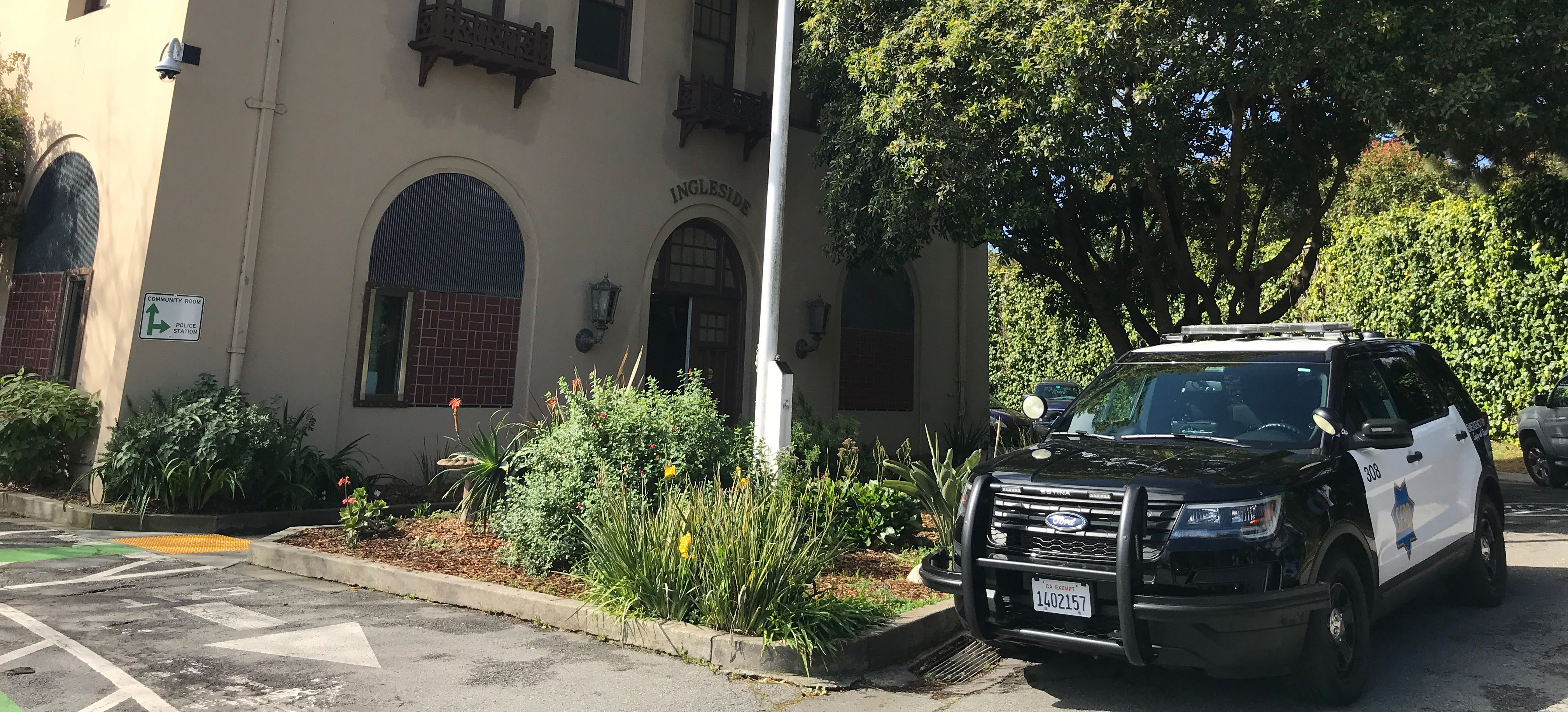 The Ingleside Police Station with a police cruiser parked in front of it. 