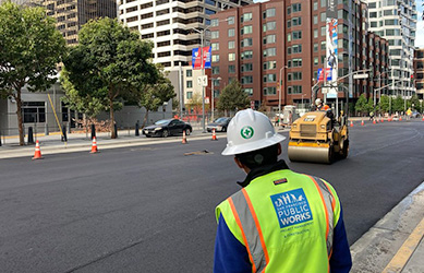 an engineer oversees a paving project