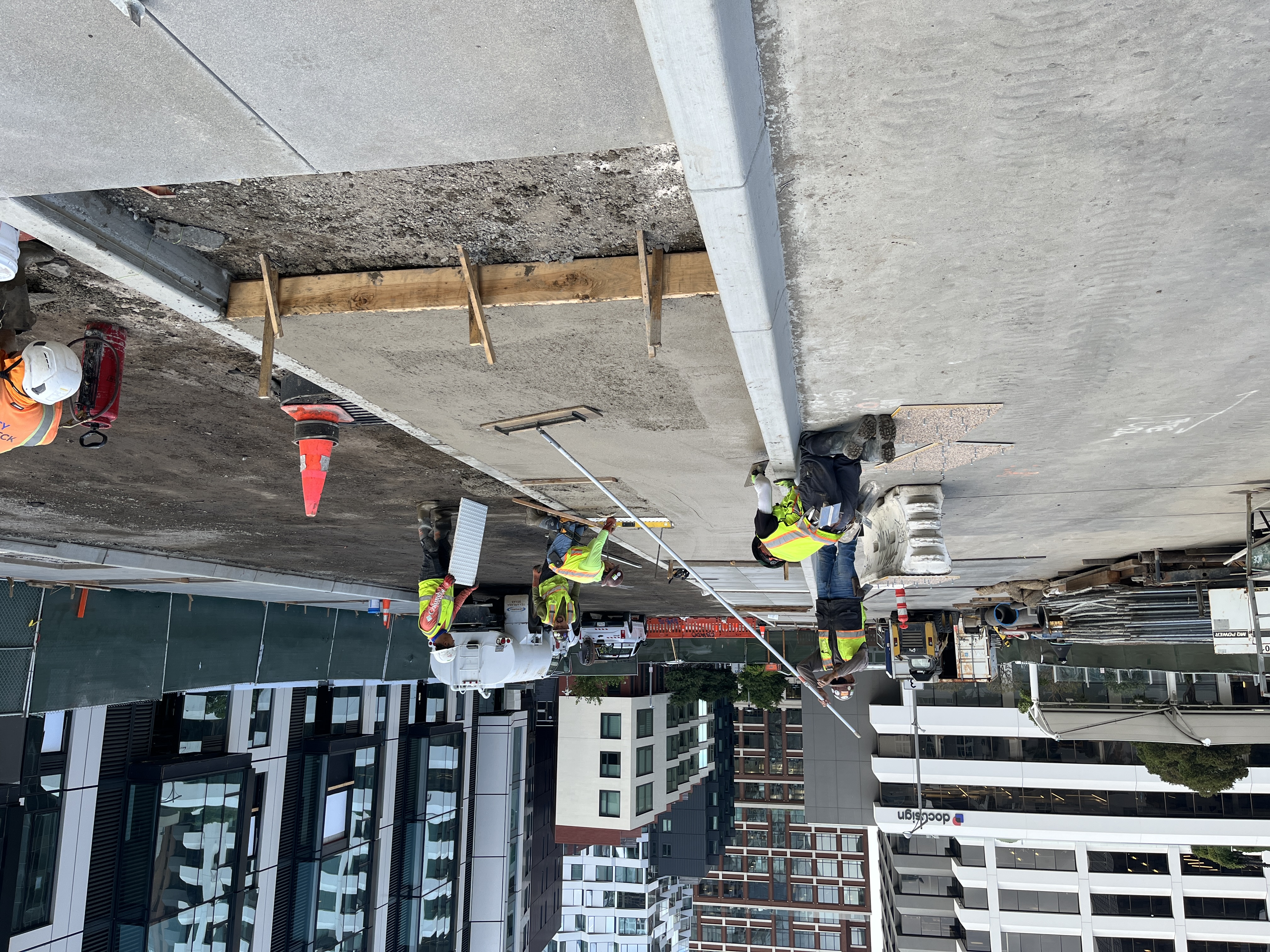 photo of sidewalk being poured on East Clementina Street