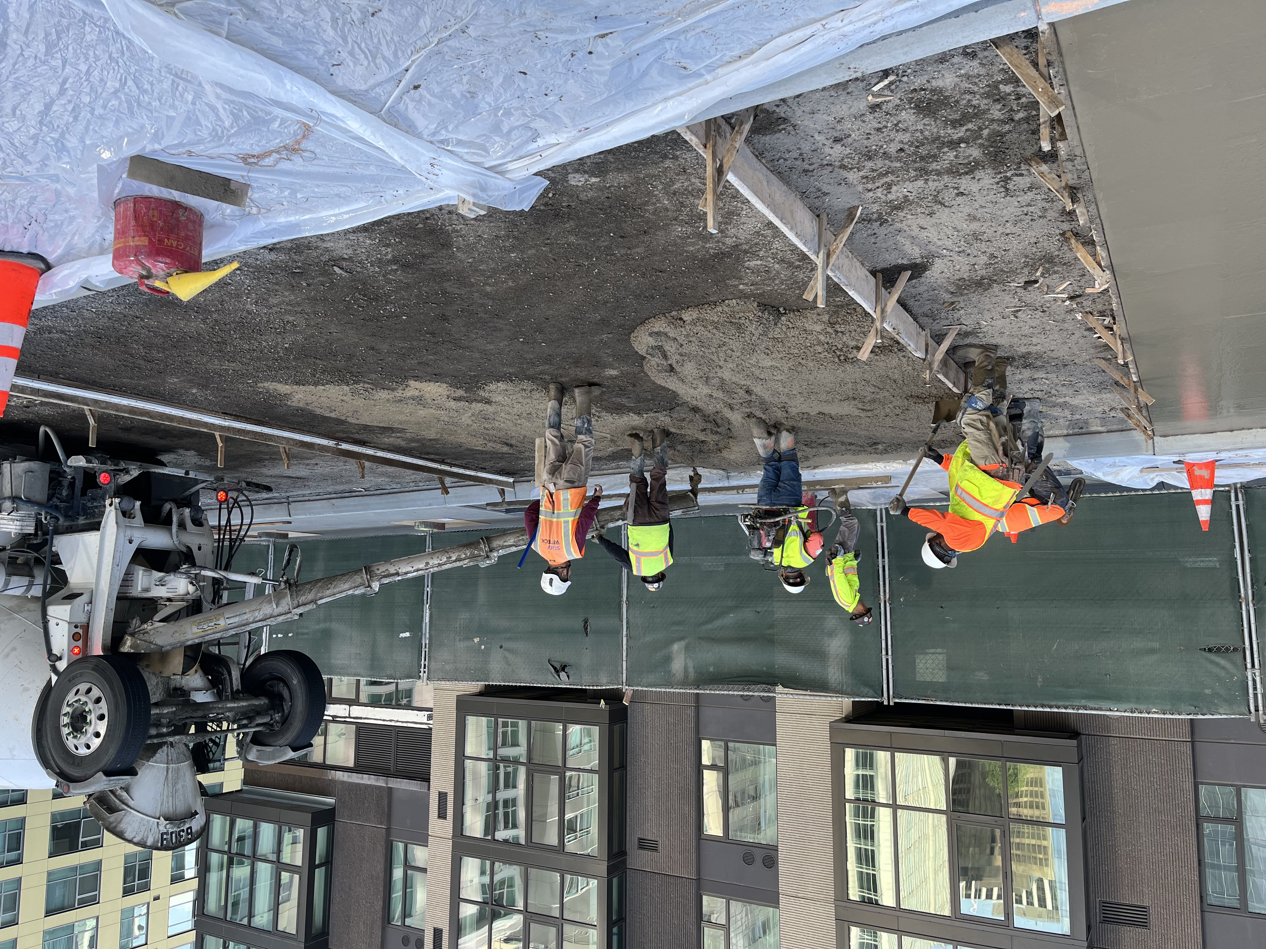 photo of concrete roadway being poured on East Clementina Street