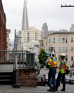 Public Works Architectural Assistant KC Lin walks along the cable car barn in Nob Hill to map the site using a new scanning and surveying tool.