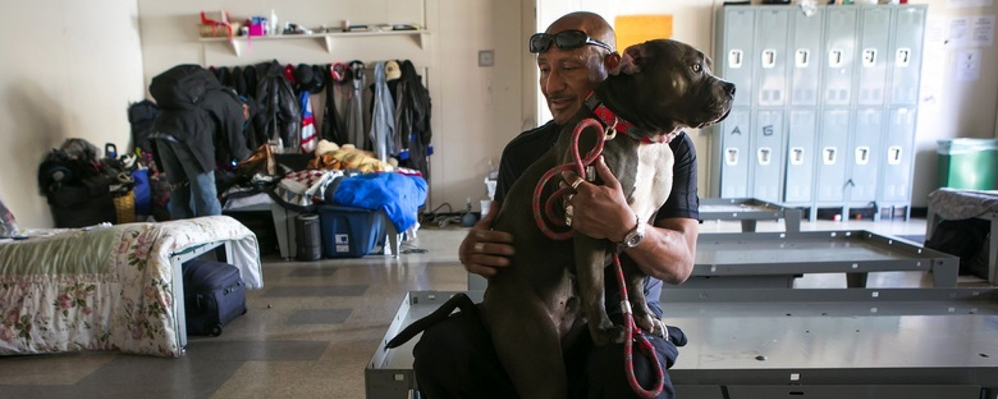 Resident and his dog in the Navigation Center dorm