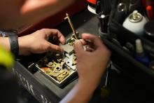 locksmith cleaning the parts of a mortise lock