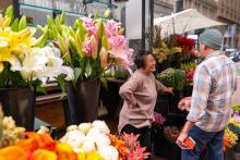 Photo of florist Valerie Chieng talking to a customer. Selling flowers isn’t only about earning a living, it’s also about people-to-people connections.